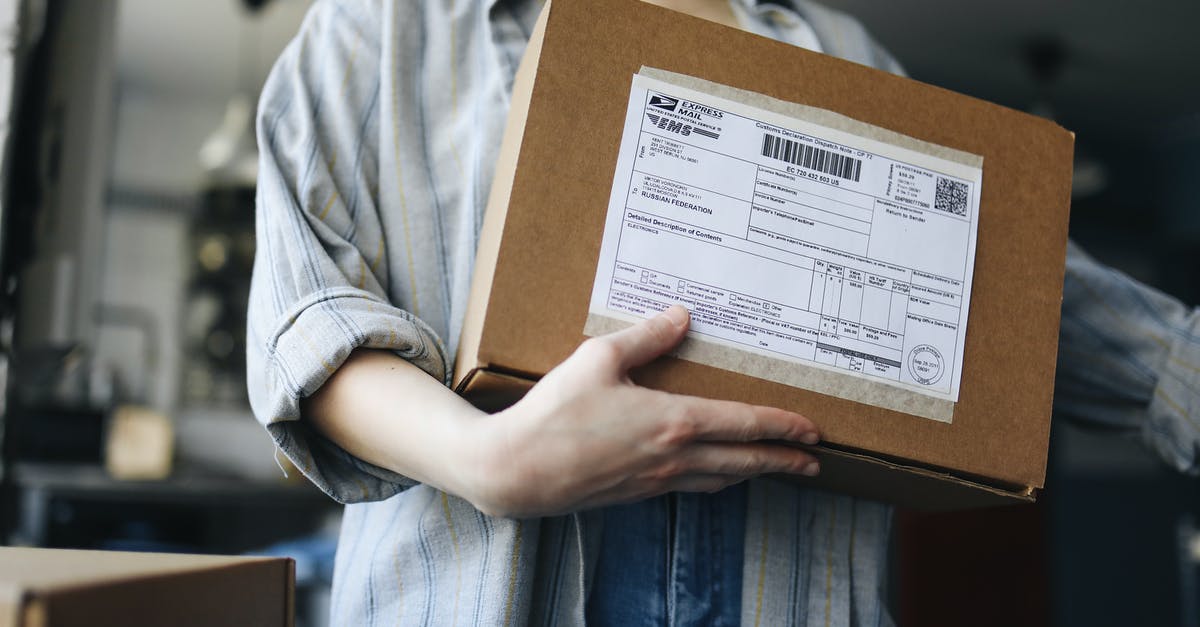 10 cent package - Person Holding Brown Cardboard Box 10 cent package - Person Holding Brown Cardboard Box