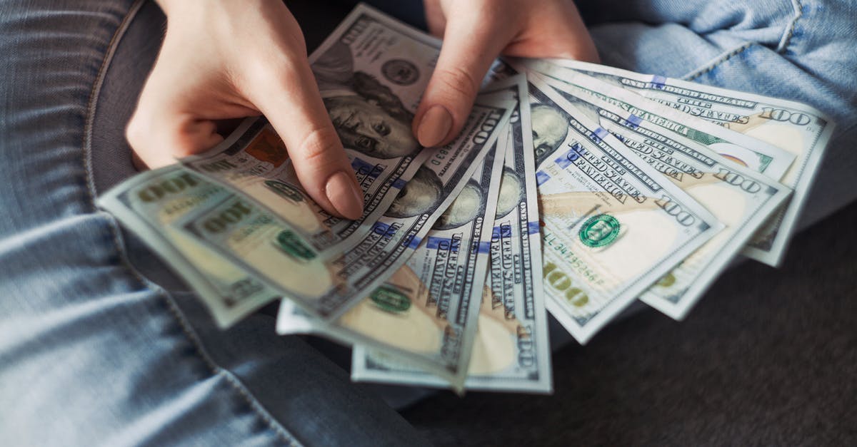 12 count versus 24 count cupcake pan - Person Holding 100 Us Dollar Banknotes 12 count versus 24 count cupcake pan - Person Holding 100 Us Dollar Banknotes