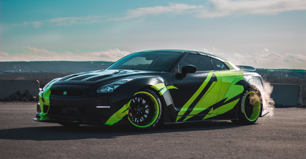 A good way to smoke Picanha? - Modern tuned sports car with tinted windows drifting on asphalt road against cloudy blue sky A good way to smoke Picanha? - Modern tuned sports car with tinted windows drifting on asphalt road against cloudy blue sky