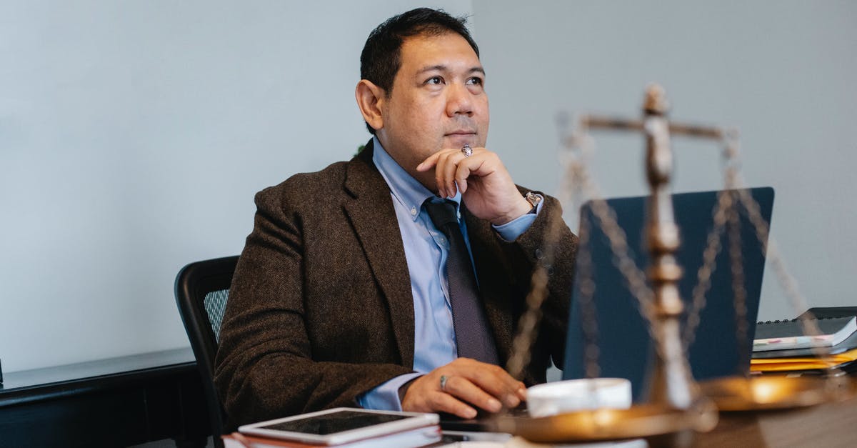 A strange problem with BWT Initium 2.5 l filter's scale - Asian male judge working on laptop in office A strange problem with BWT Initium 2.5 l filter's scale - Asian male judge working on laptop in office