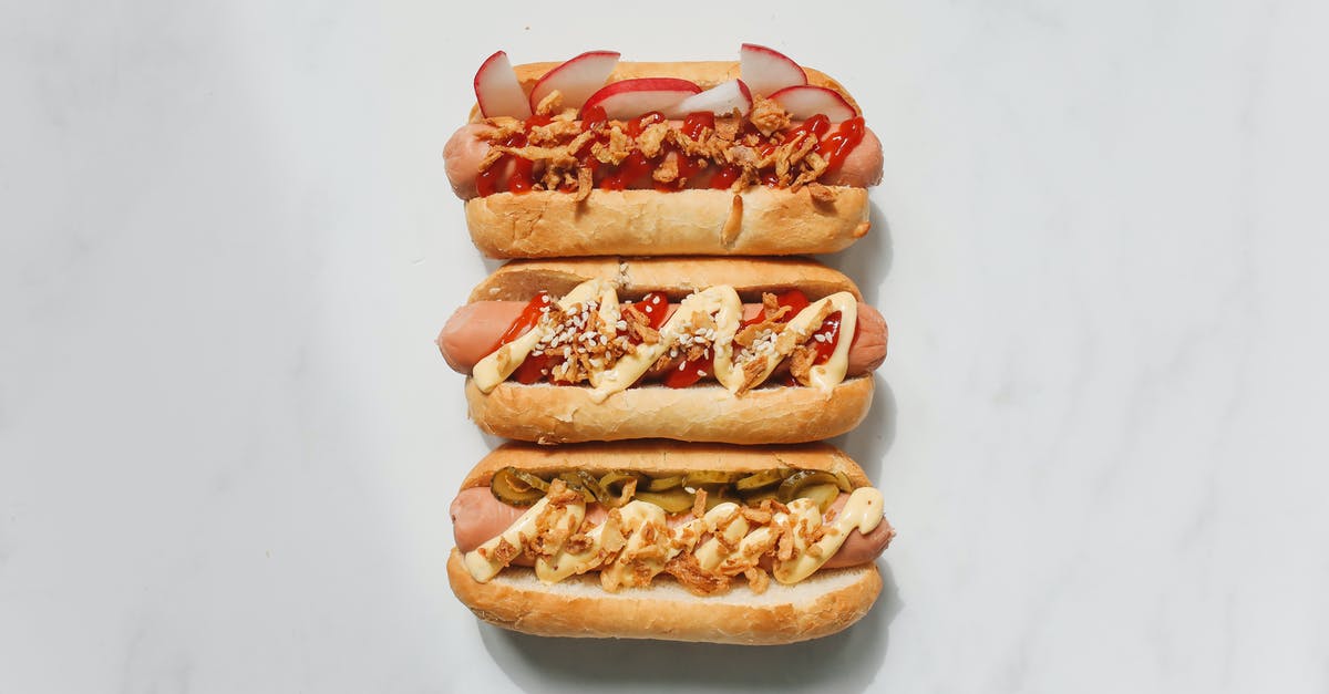 Accidentally refrigerated Mayonnaise - Hotdog Sandwiches on White Background Accidentally refrigerated Mayonnaise - Hotdog Sandwiches on White Background
