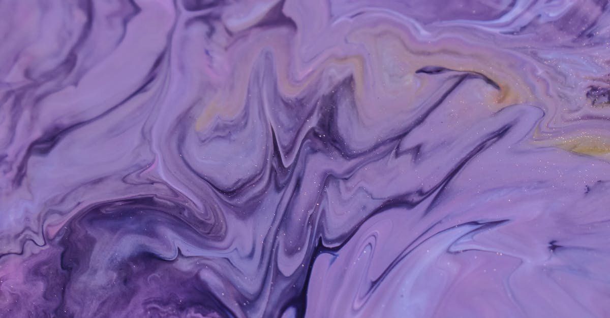 Achieving 'glossy', ultra smooth pudding texture - Full frame background of glossy purple ink mixing and blending on uneven surface Achieving 'glossy', ultra smooth pudding texture - Full frame background of glossy purple ink mixing and blending on uneven surface
