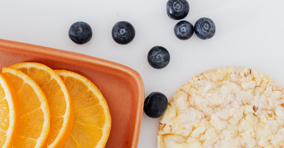 Adapting graham cracker crust to all-natural graham crackers - From above of fresh orange slices placed on cutting board near blueberries and rice cracker on white surface Adapting graham cracker crust to all-natural graham crackers - From above of fresh orange slices placed on cutting board near blueberries and rice cracker on white surface