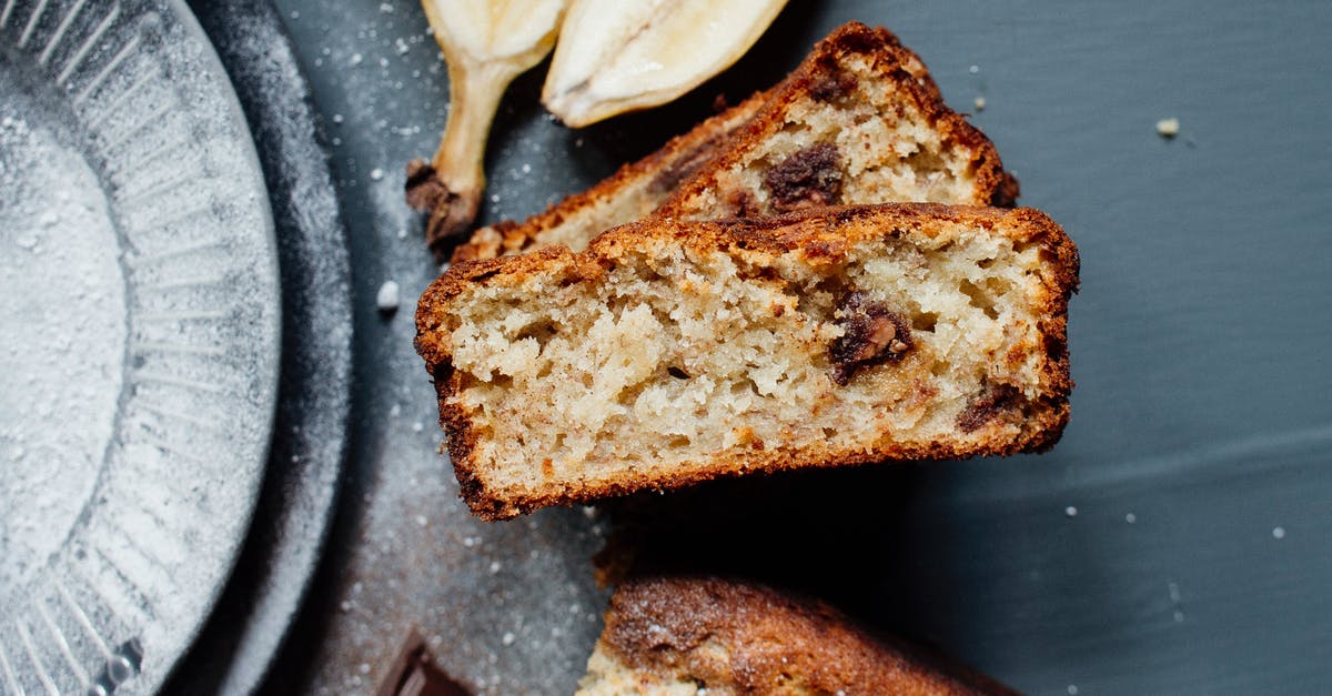 Adding fresh fruit to a non fruited banana bread - Tasty banana bread slices on table Adding fresh fruit to a non fruited banana bread - Tasty banana bread slices on table