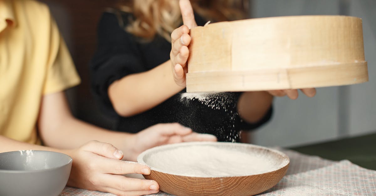 Adjusting dessert recipes to accomodate a larger slow cooker - Unrecognizable little children sifting flour together Adjusting dessert recipes to accomodate a larger slow cooker - Unrecognizable little children sifting flour together