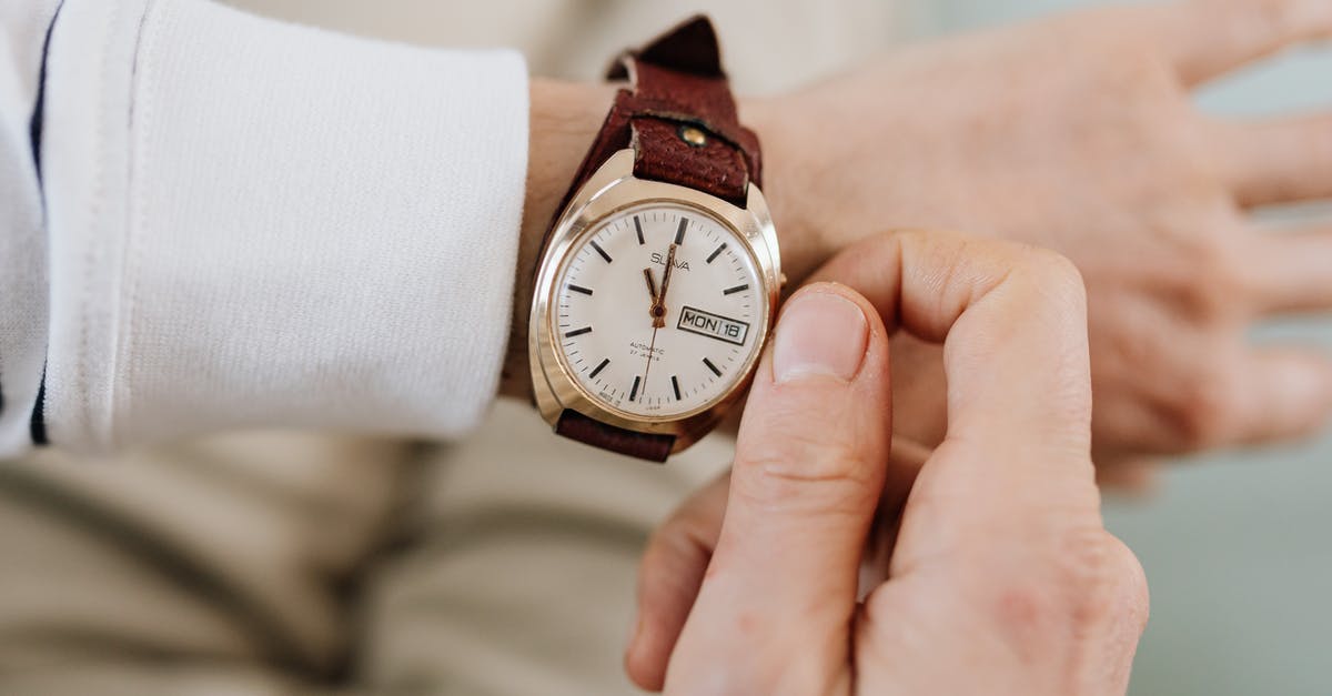 Adjusting the baking time for large cakes? - Person Wearing a Wristwatch Adjusting the baking time for large cakes? - Person Wearing a Wristwatch