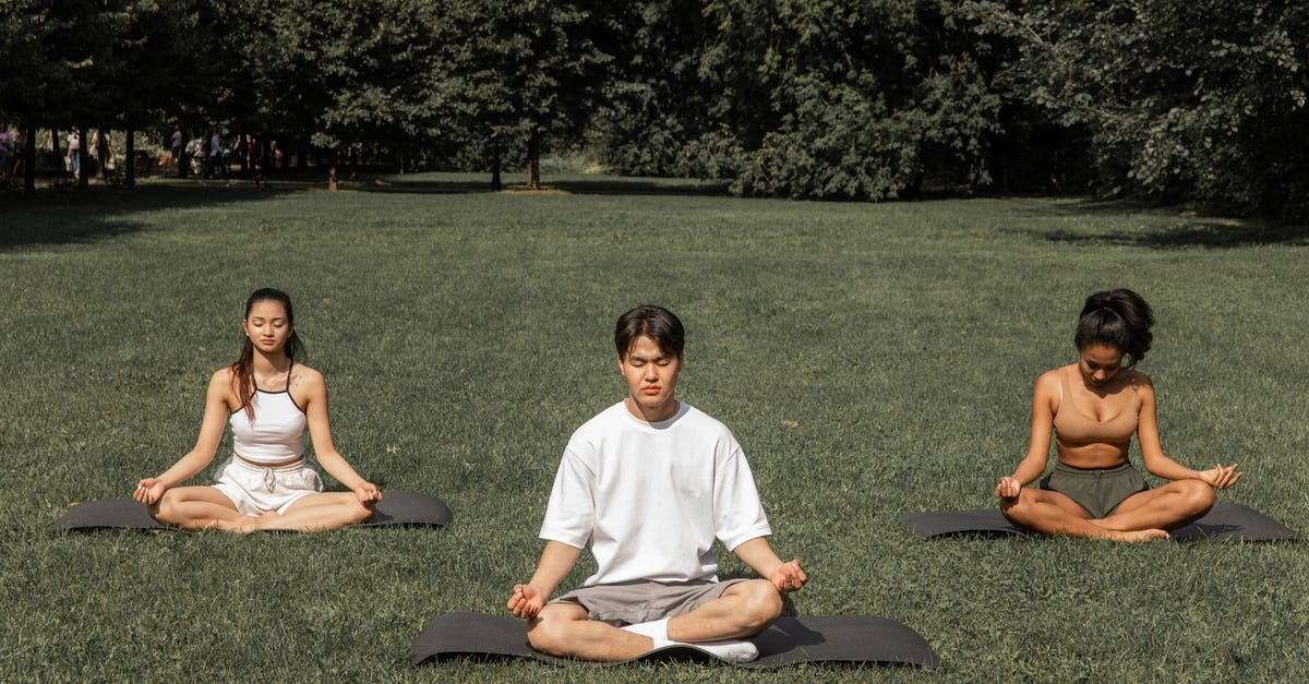 Advantage of flexible cutting mat? [closed] - Full length of peaceful people in sportswear sitting in Padmasana with closed eyes and meditating in summer garden