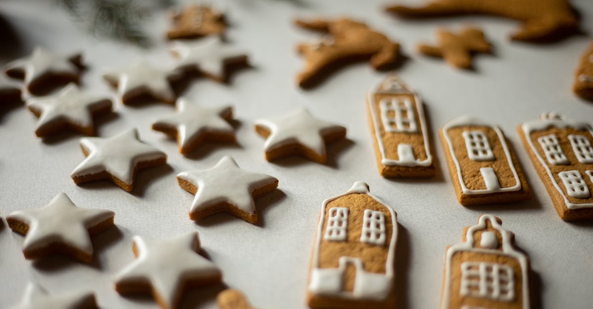 Advice for gingerbread houses? - Gingerbread Cookies Laid on White Surface Advice for gingerbread houses? - Gingerbread Cookies Laid on White Surface