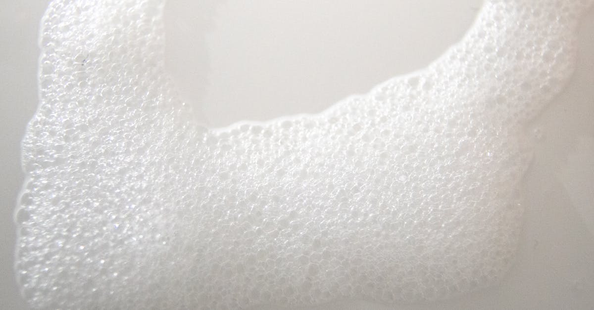 Air bubble on surface of chocolate - Abstract background of white foam on smooth surface Air bubble on surface of chocolate - Abstract background of white foam on smooth surface