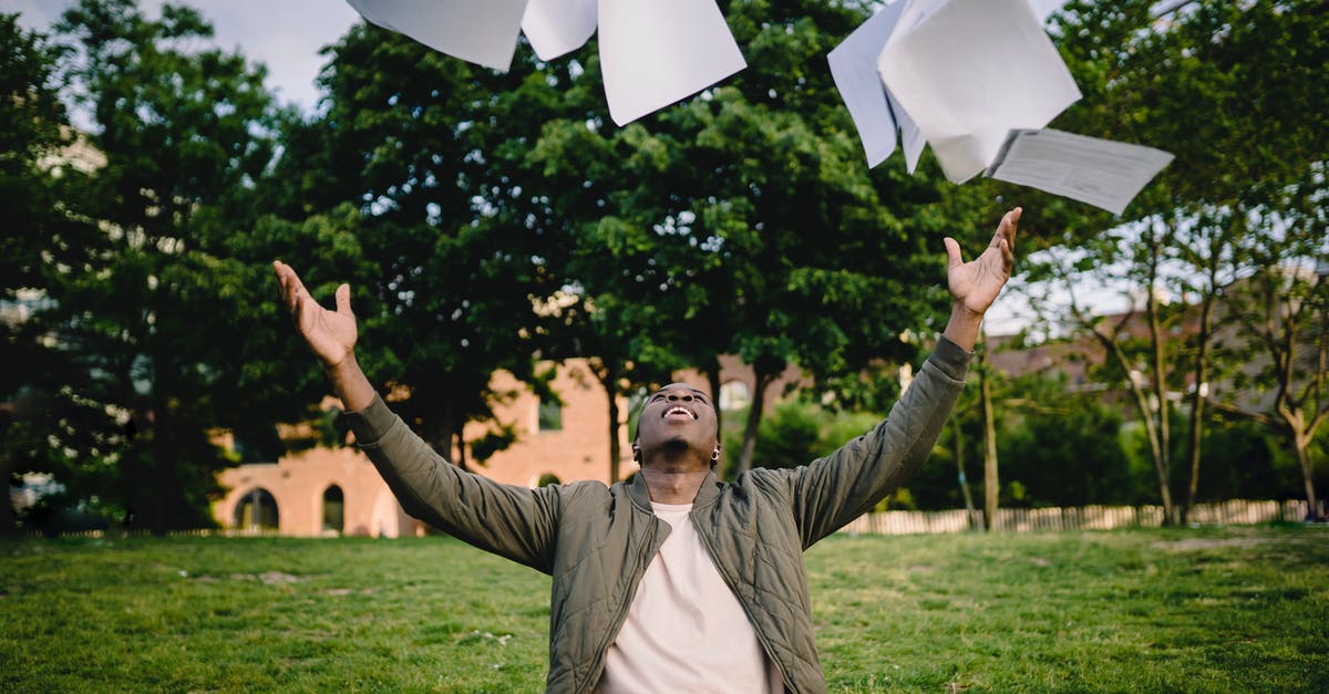Air fried sweet potatoes have black dots on them - Happy young African American male student in casual outfit tossing university papers in air while having fun in green park after successfully completing academic assignments Air fried sweet potatoes have black dots on them - Happy young African American male student in casual outfit tossing university papers in air while having fun in green park after successfully completing academic assignments