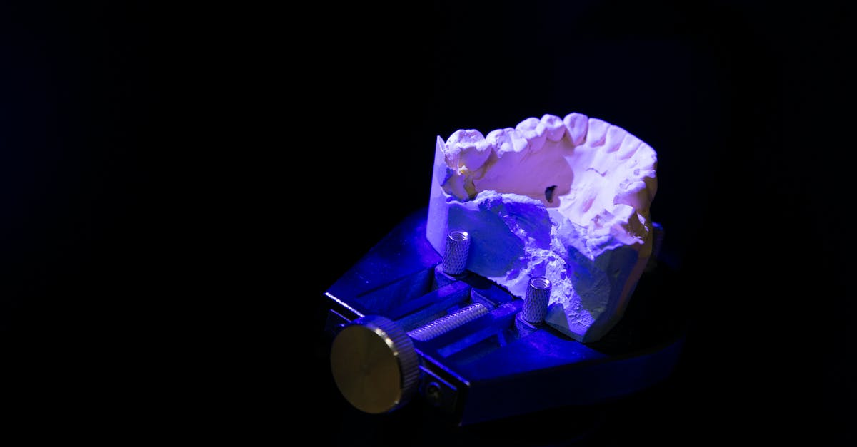 Air Gaps In Molds Creating White Patches On De-molded Chocolate - White dental impression under neon illumination Air Gaps In Molds Creating White Patches On De-molded Chocolate - White dental impression under neon illumination
