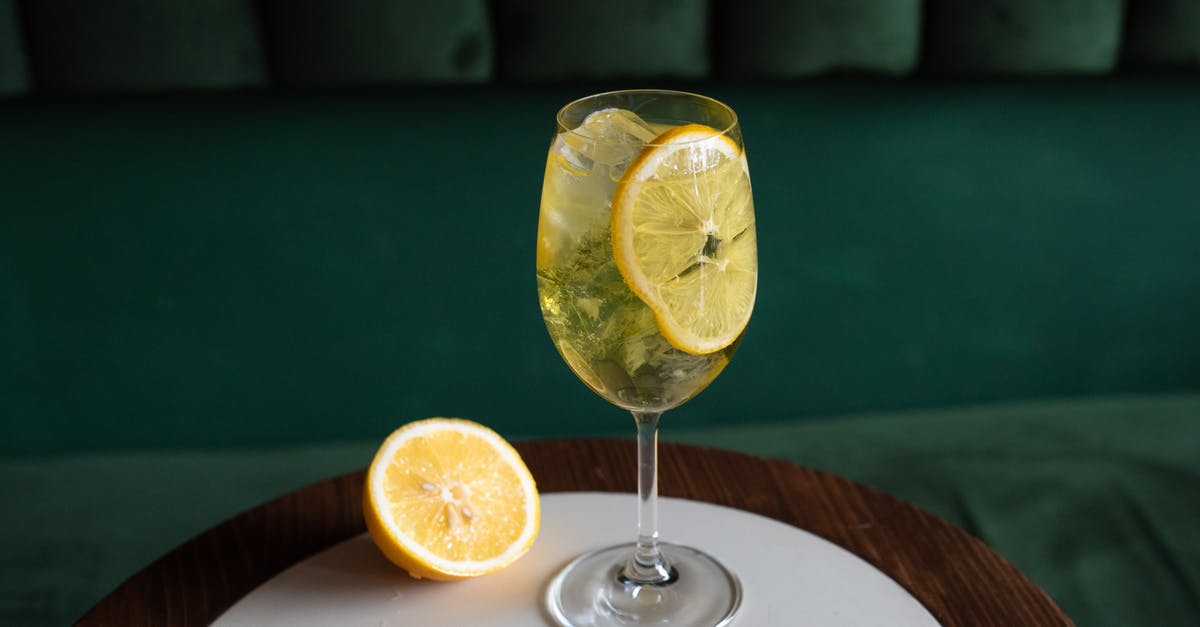 Alcohol level still the same after being soaked with dried fruit - A Clear Wine Glass With Sliced Lemon on the Table Alcohol level still the same after being soaked with dried fruit - A Clear Wine Glass With Sliced Lemon on the Table