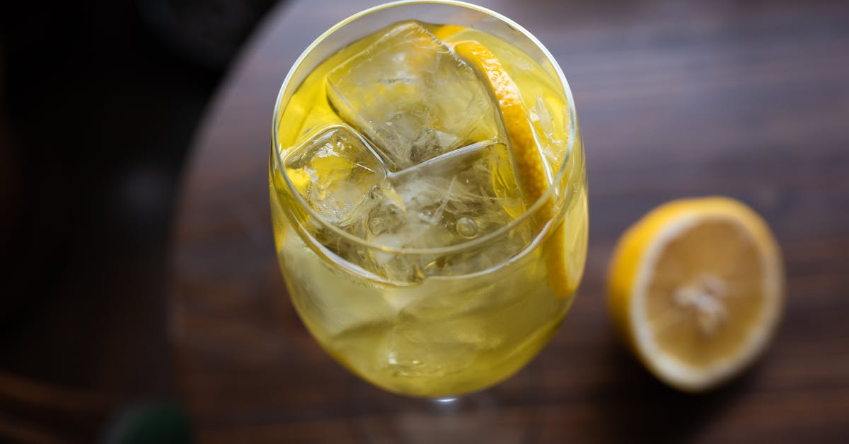 Alcohol level still the same after being soaked with dried fruit - A Clear Wine Glass with Ice and Sliced Lemon Alcohol level still the same after being soaked with dried fruit - A Clear Wine Glass with Ice and Sliced Lemon