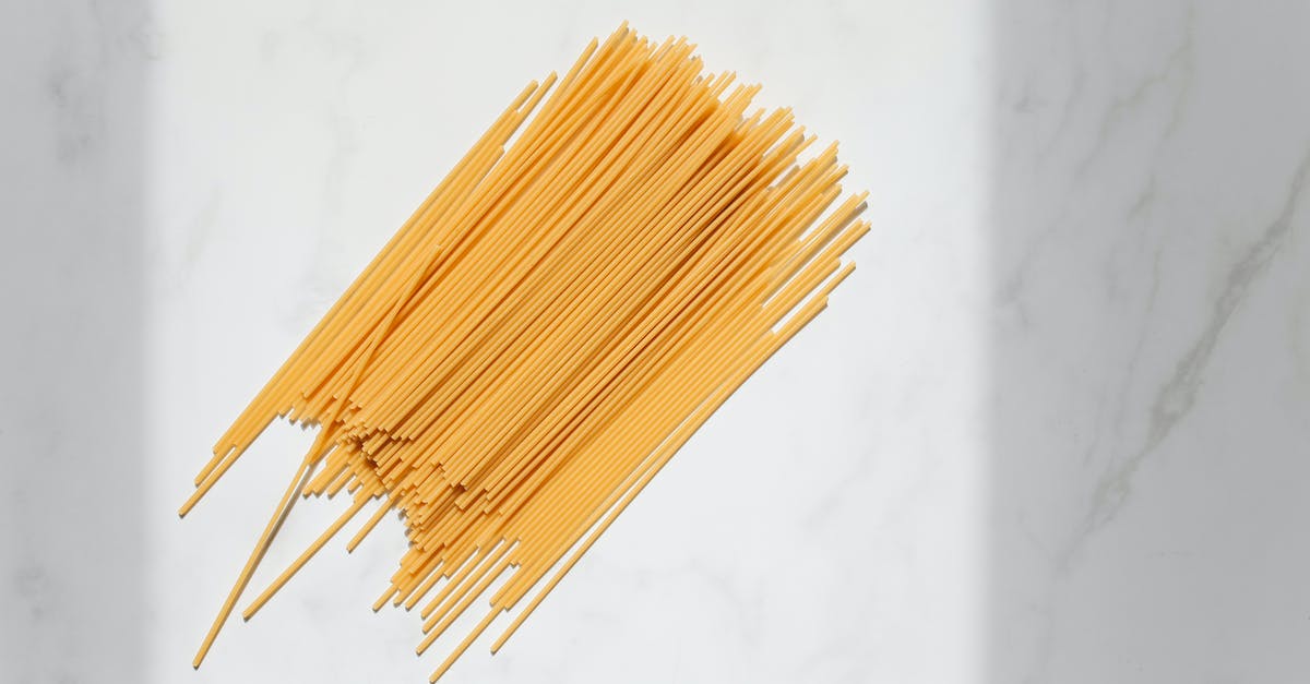 Alkaline ramen noodles shelf life in uncooked state - Uncooked Spaghetti Noodles on White Surface Alkaline ramen noodles shelf life in uncooked state - Uncooked Spaghetti Noodles on White Surface