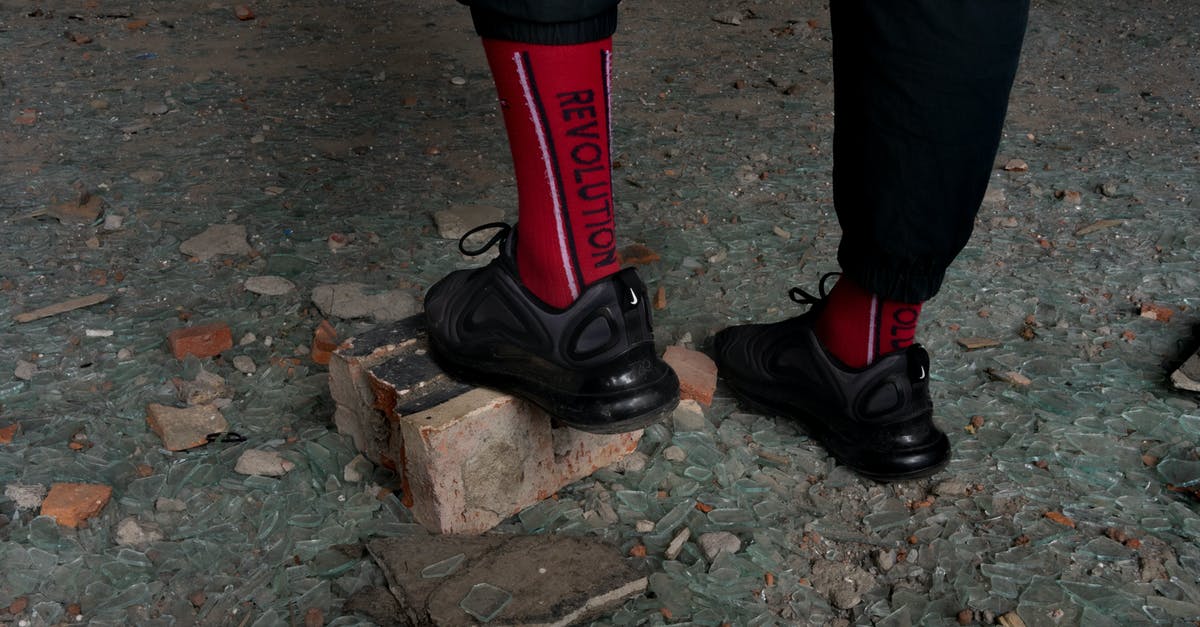 Alternative to Wisconsin Brick Cheese - Male legs in sneakers and stylish socks Alternative to Wisconsin Brick Cheese - Male legs in sneakers and stylish socks