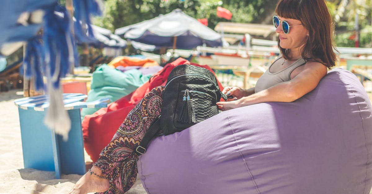 Animal Stock from Vegetable Stock - Woman Wearing Gray Tank Top Sitting on Purple Bean Bag Animal Stock from Vegetable Stock - Woman Wearing Gray Tank Top Sitting on Purple Bean Bag