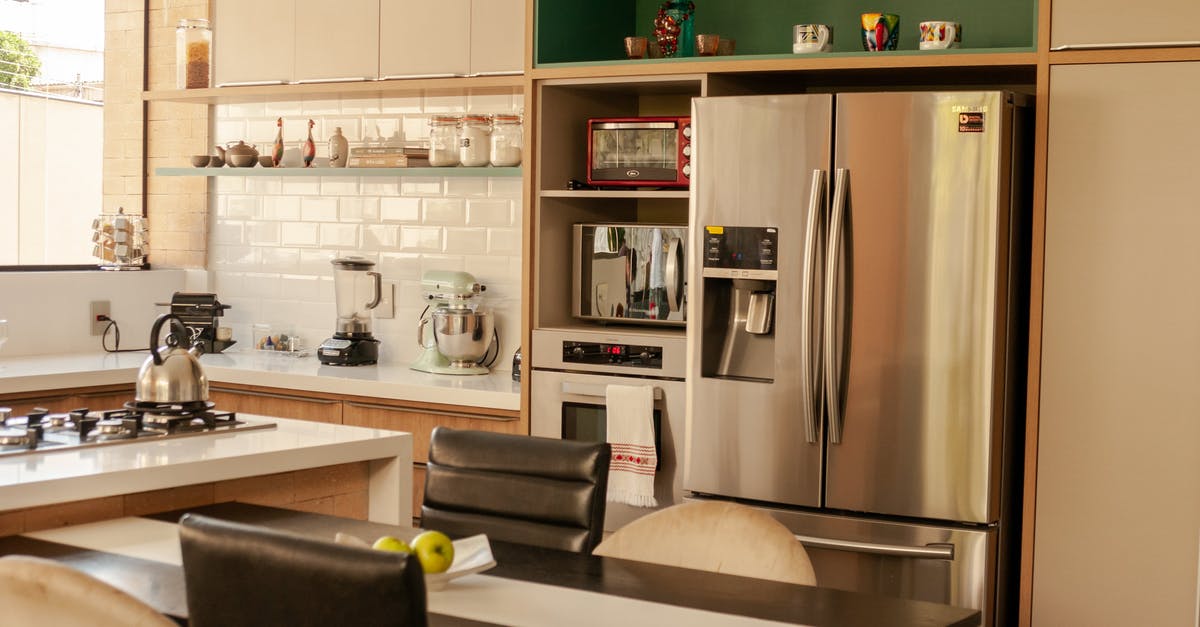 Any cheap ways to clean restaurant stainless steel fridge? - Modern stainless steel appliances and minimalist furniture in stylish kitchen in sunny morning Any cheap ways to clean restaurant stainless steel fridge? - Modern stainless steel appliances and minimalist furniture in stylish kitchen in sunny morning