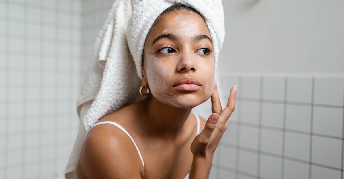 Applying a binder to chicken after wet marinating - Woman Applying Face Cream Applying a binder to chicken after wet marinating - Woman Applying Face Cream