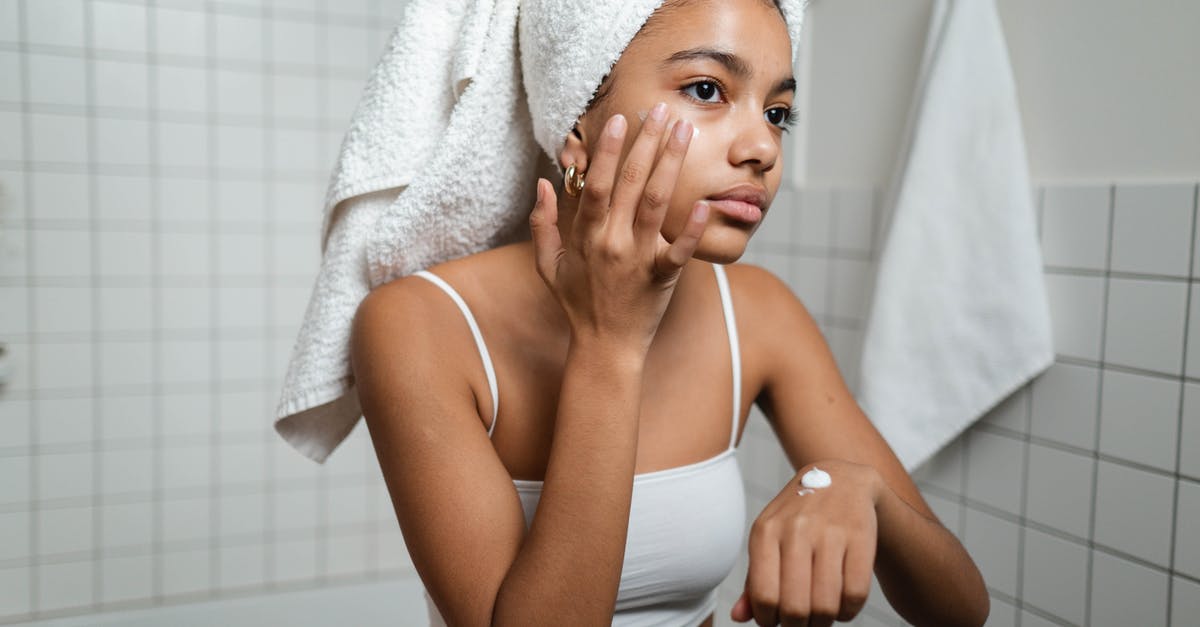 Applying a binder to chicken after wet marinating - Woman Applying Face Cream Applying a binder to chicken after wet marinating - Woman Applying Face Cream