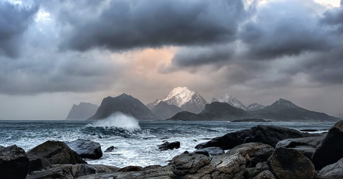 Arctic char available in North-America - Waves Crashing on Rock Near Mountains during Datyime Arctic char available in North-America - Waves Crashing on Rock Near Mountains during Datyime