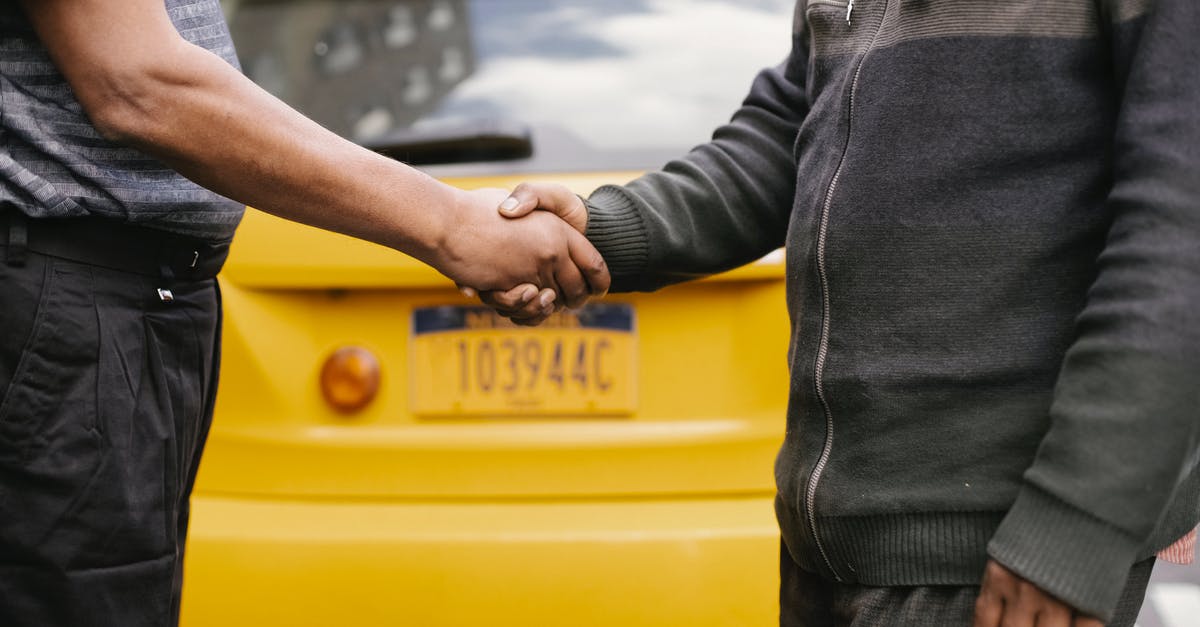 Are all emulsifying agents created equal - Side view of crop ethnic anonymous males shaking hands while meeting each other on street Are all emulsifying agents created equal - Side view of crop ethnic anonymous males shaking hands while meeting each other on street