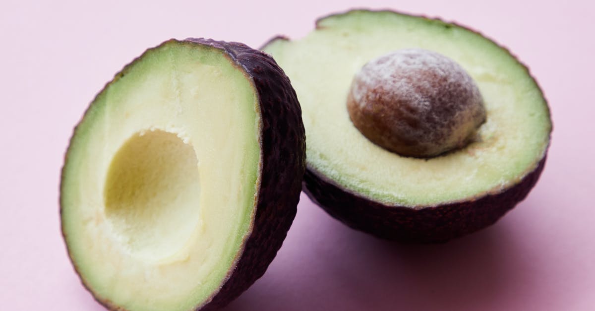 Are avocado seeds edible? - Halves of unpeeled avocado in studio Are avocado seeds edible? - Halves of unpeeled avocado in studio