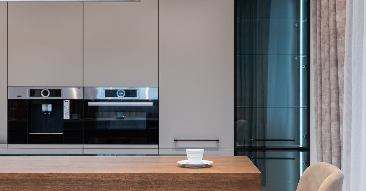 Are coffee mugs oven safe? - Modern room with kitchenware and counter with coffee cup near chairs and curtains with cabinet and oven Are coffee mugs oven safe? - Modern room with kitchenware and counter with coffee cup near chairs and curtains with cabinet and oven