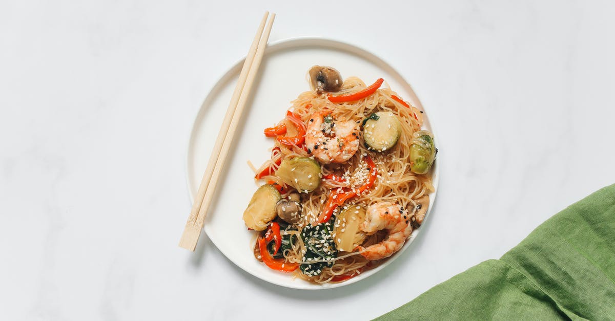 Are cooked shrimp shells edible? - Food on White Ceramic Plate with Chopsticks Are cooked shrimp shells edible? - Food on White Ceramic Plate with Chopsticks