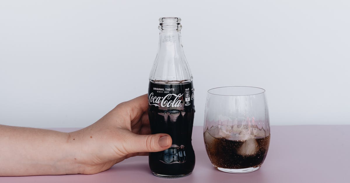 Are ice tea in bottles considered as carbonated drinks like coke? - Photo Of Person Holding Bottled Soft Drinks Are ice tea in bottles considered as carbonated drinks like coke? - Photo Of Person Holding Bottled Soft Drinks