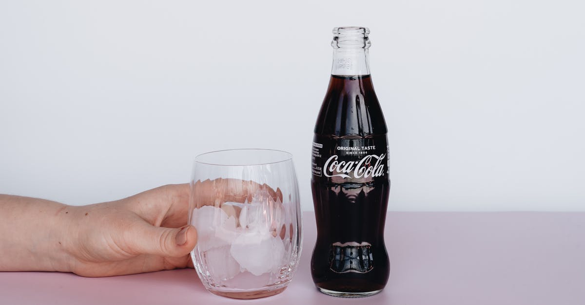 Are ice tea in bottles considered as carbonated drinks like coke? - Photo Of Person Holding Glass With Ice Are ice tea in bottles considered as carbonated drinks like coke? - Photo Of Person Holding Glass With Ice