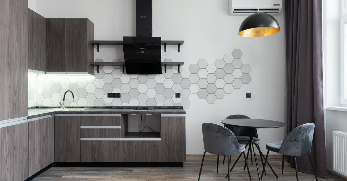 Are mushrooms with interior holes ok? - Creative design of kitchen with cupboards and cabinets under hood against table with chairs in daylight at home