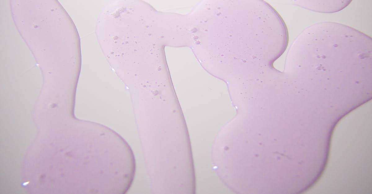Are purple spots in freezer safe? - Abstract background of gel spilled on white surface Are purple spots in freezer safe? - Abstract background of gel spilled on white surface