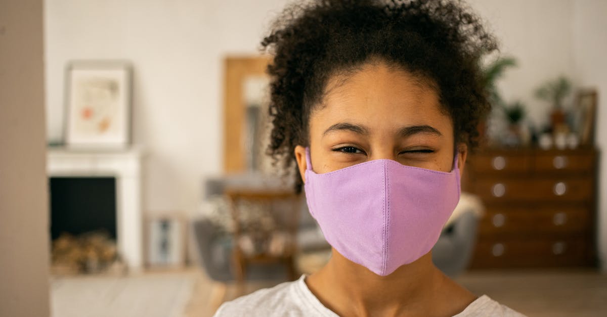 Are purple spots in freezer safe? - Cheerful African American teenage girl wearing protective mask winking and looking at camera on blurred background during coronavirus pandemic at home Are purple spots in freezer safe? - Cheerful African American teenage girl wearing protective mask winking and looking at camera on blurred background during coronavirus pandemic at home