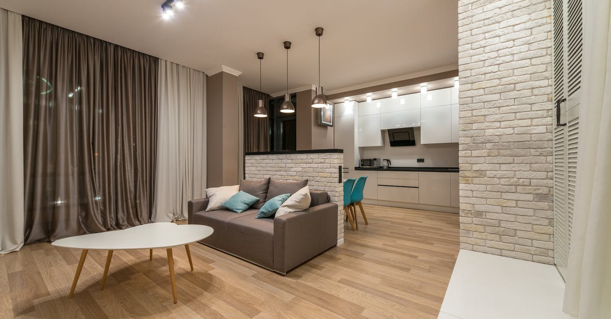Are recirculation extractor hoods good? - Living room with couch near kitchen Are recirculation extractor hoods good? - Living room with couch near kitchen