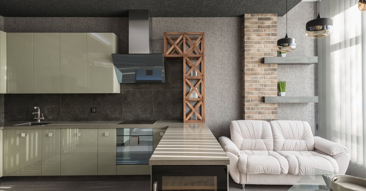 Are recirculation extractor hoods good? - White leather sofa placed near kitchen counter with modern appliances in light stylish decorated apartment with window and hanging lamps Are recirculation extractor hoods good? - White leather sofa placed near kitchen counter with modern appliances in light stylish decorated apartment with window and hanging lamps