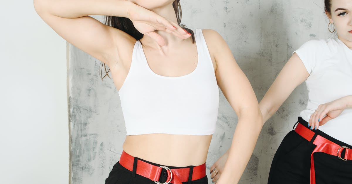 Are red lentils and split red lentils the same? - Crop young female dancers in same clothes with red belt and in black pants making dancing movements near gray wall Are red lentils and split red lentils the same? - Crop young female dancers in same clothes with red belt and in black pants making dancing movements near gray wall