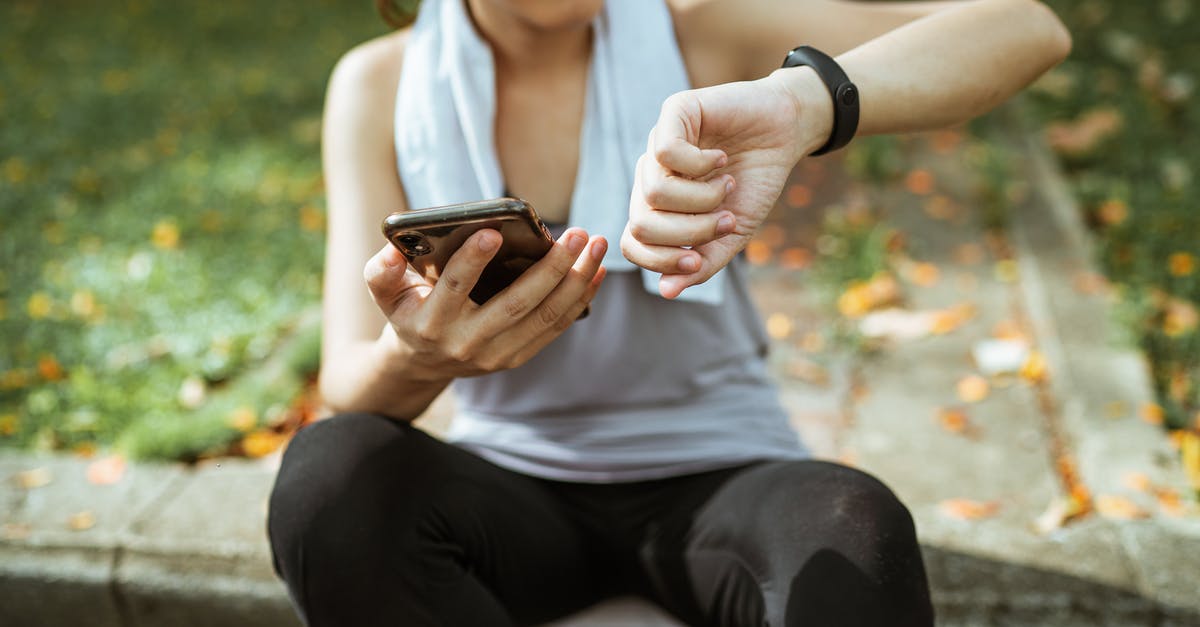 Are sausages made using the whole body of a chick? - Anonymous female in sportswear using smartphone and smart watch after exercising on sports ground Are sausages made using the whole body of a chick? - Anonymous female in sportswear using smartphone and smart watch after exercising on sports ground