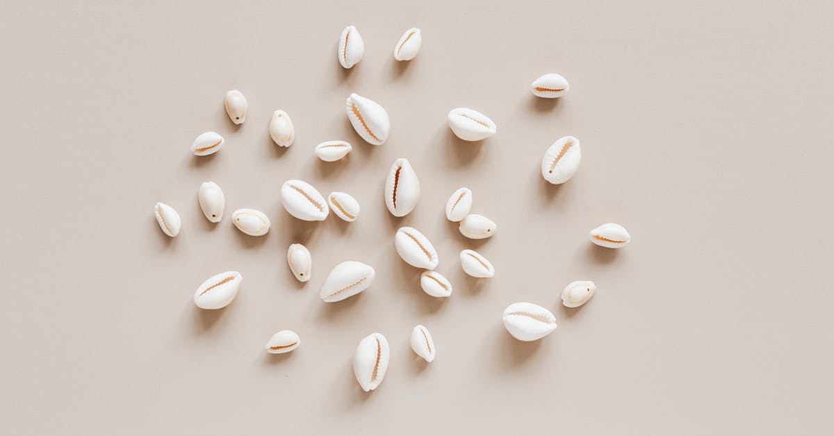 Are smoothies and milk shakes the same things with different names? - Top view composition of shells assorted sizes arranged randomly on beige surface Are smoothies and milk shakes the same things with different names? - Top view composition of shells assorted sizes arranged randomly on beige surface