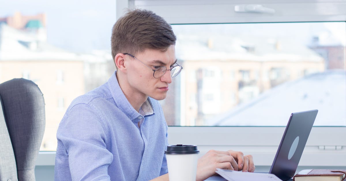 Are the white dots mould or part of the bread? - Woman in Blue Long Sleeve Shirt Using Macbook Pro Are the white dots mould or part of the bread? - Woman in Blue Long Sleeve Shirt Using Macbook Pro