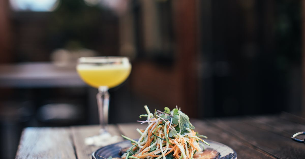Are there culinary applications for carrot tops/greens? - Delicious noodle salad with cocktail in bar Are there culinary applications for carrot tops/greens? - Delicious noodle salad with cocktail in bar