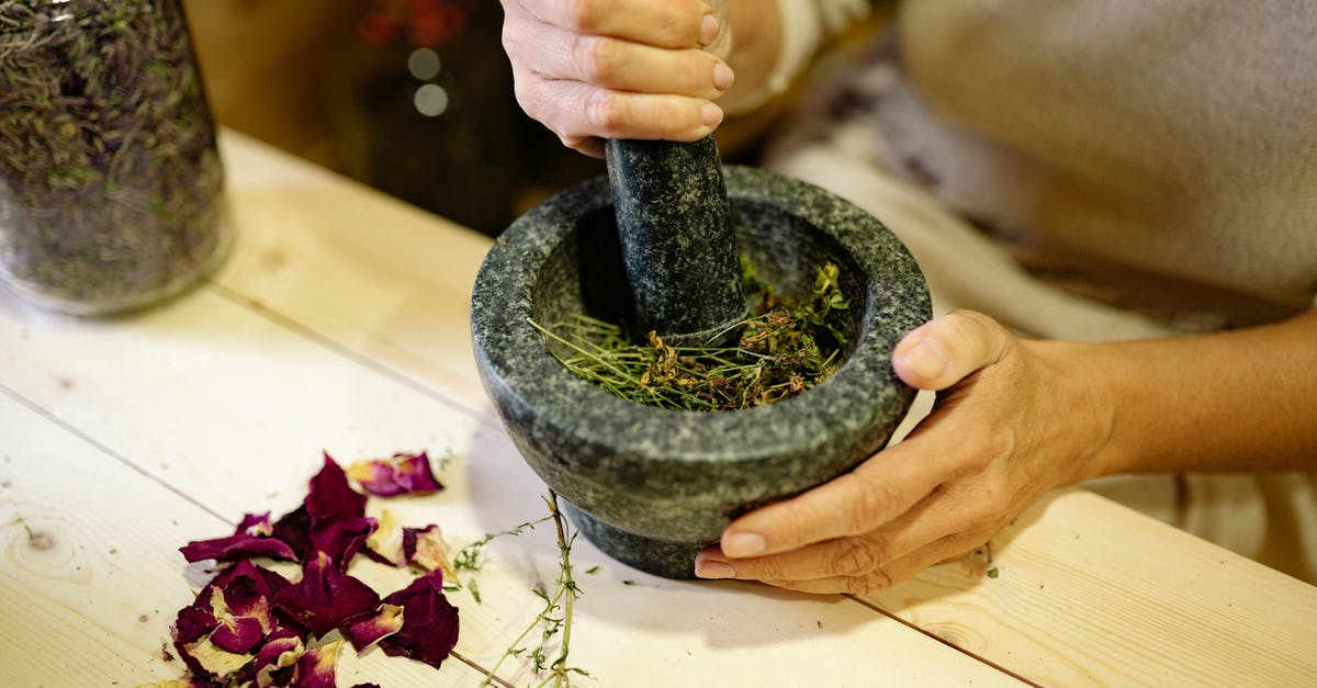 Are there substantial benefits to grinding your own flour? - Close-up of a Person Grinding Spices in a Mortar Are there substantial benefits to grinding your own flour? - Close-up of a Person Grinding Spices in a Mortar