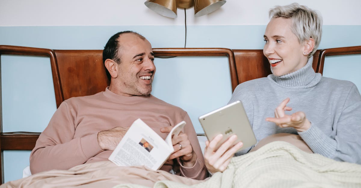 Are there uses for sodium citrate other than with cheese? [closed] - Cheerful diverse couple relaxing in bed with book and tablet during lazy weekend