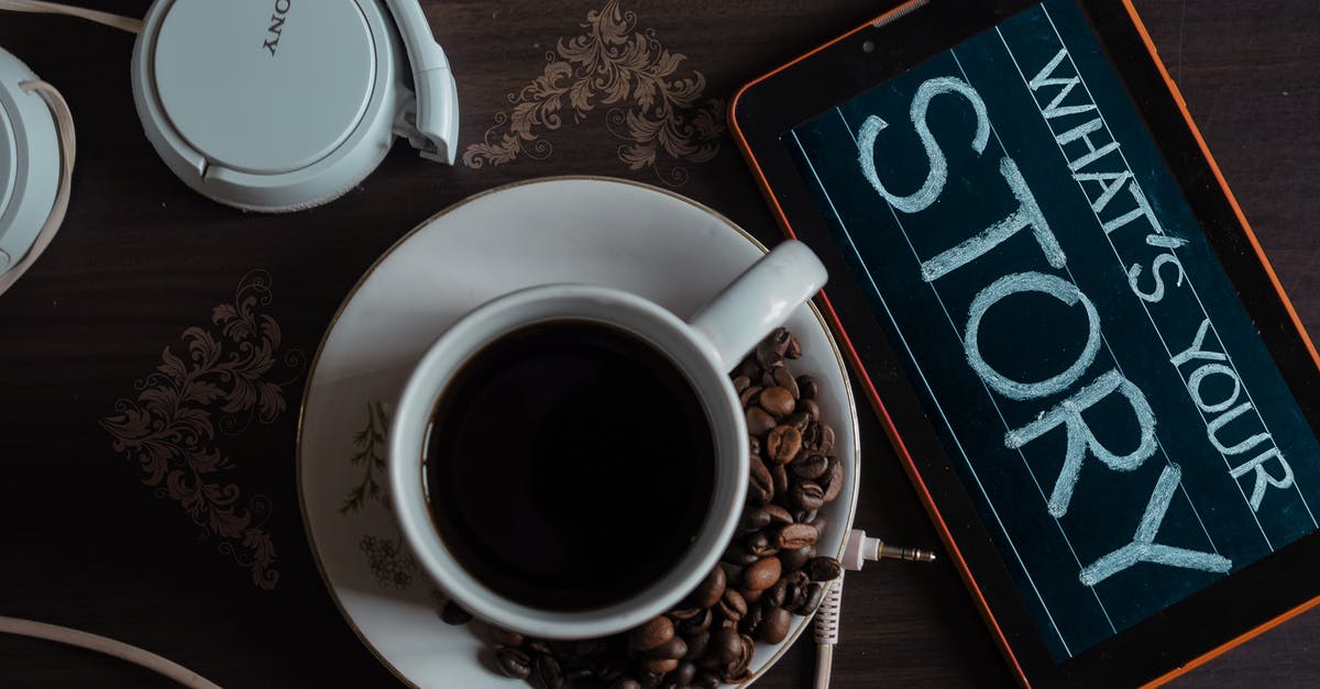 Are these coffee beans unroasted? - Top View Photo of Coffee Near Tablet Are these coffee beans unroasted? - Top View Photo of Coffee Near Tablet