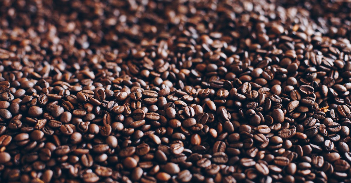 Are these coffee beans unroasted? - Close-Up Photography of Roasted Coffee Beans Are these coffee beans unroasted? - Close-Up Photography of Roasted Coffee Beans