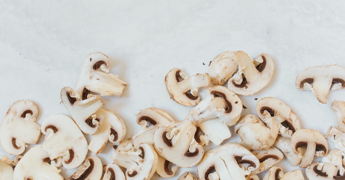 Are these mushrooms still edible? - White and Brown Sliced Mushrooms on White Surface Are these mushrooms still edible? - White and Brown Sliced Mushrooms on White Surface