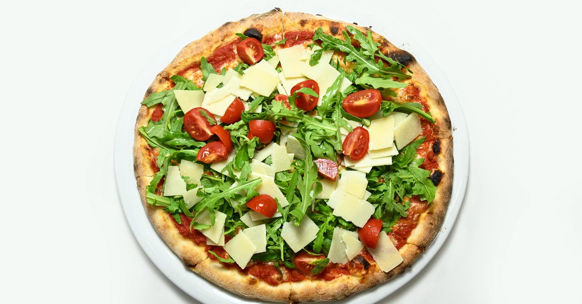 Arugula is very salty, and doesn't look like arugula - Pizza rocket Rucola you parmesan cherry tomatoes isolades Arugula is very salty, and doesn't look like arugula - Pizza rocket Rucola you parmesan cherry tomatoes isolades