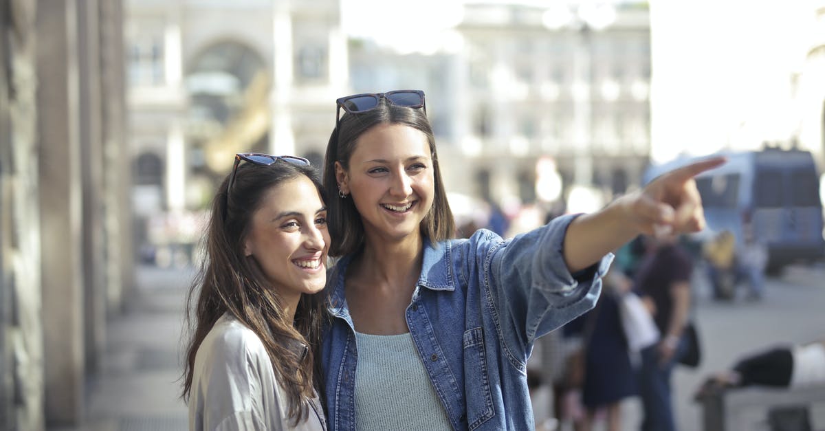 At what point should carrots be thrown away? - Happy young female friends laughing and looking away while woman in denim shirt pointing to funny place At what point should carrots be thrown away? - Happy young female friends laughing and looking away while woman in denim shirt pointing to funny place