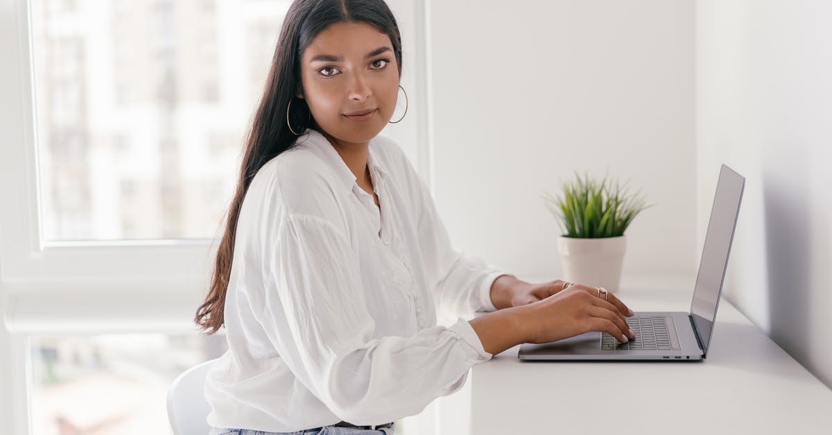 Avoiding clumps in cacio e pepe? - Woman in White Dress Shirt and Blue Denim Jeans Sitting on White Chair Avoiding clumps in cacio e pepe? - Woman in White Dress Shirt and Blue Denim Jeans Sitting on White Chair