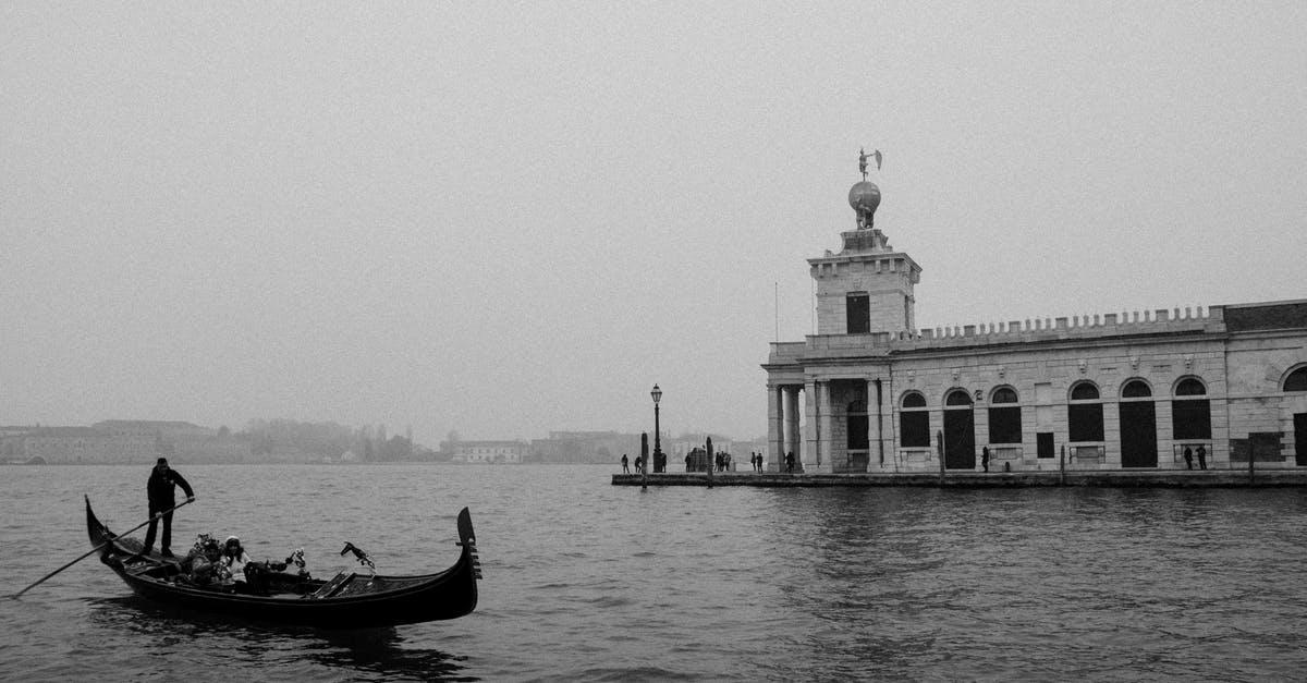 Béchamel and pomodoro - Grayscale Photo of Man Riding on Boat on Sea Béchamel and pomodoro - Grayscale Photo of Man Riding on Boat on Sea