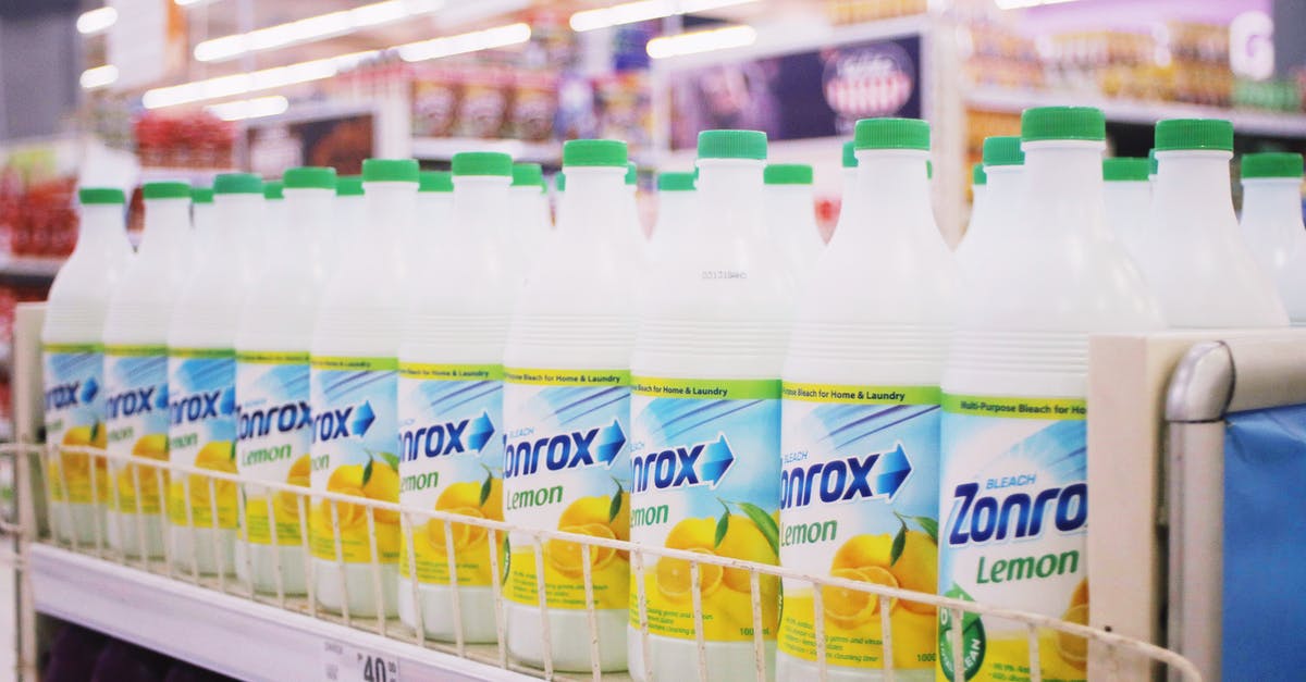 Bacteria contamination inside a thermos bottle - Rows of plastic bottles of bleach with smell of lemon placed on shelves in supermarket Bacteria contamination inside a thermos bottle - Rows of plastic bottles of bleach with smell of lemon placed on shelves in supermarket